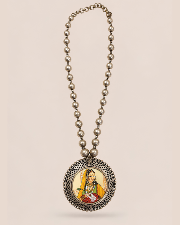 Vistaar handcrafted statement necklace inspired by Indian miniature art with an antique silver-finish beaded chain and portrait pendant by House of Evia.