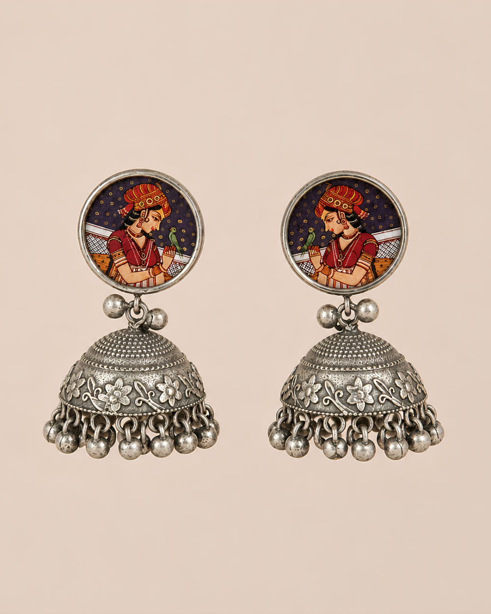Dastaan statement jhumka earrings with hand-painted miniature portraits and antique silver detailing