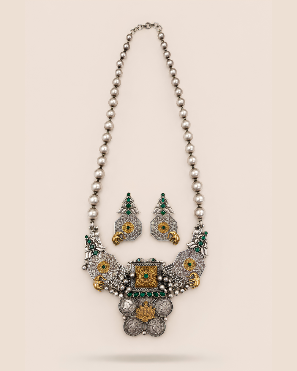 Aarambh (आरम्भ) heritage statement jewellery set featuring a green stone statement neckpiece and matching statement earrings by House of Evia.