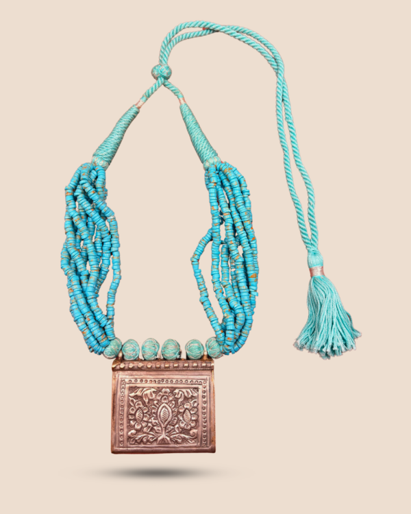 Katha handmade multi-strand turquoise heishi bead necklace with embossed floral box pendant and adjustable tassel dori