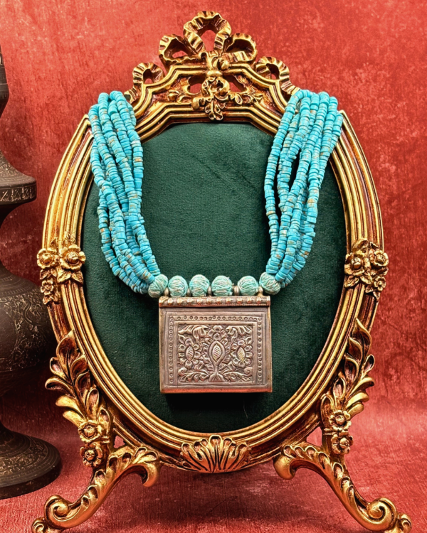 Katha handmade multi-strand turquoise heishi bead necklace with embossed floral box pendant and adjustable tassel dori