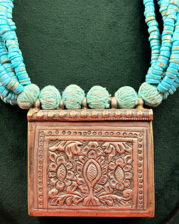 Katha handmade multi-strand turquoise heishi bead necklace with embossed floral box pendant and adjustable tassel dori